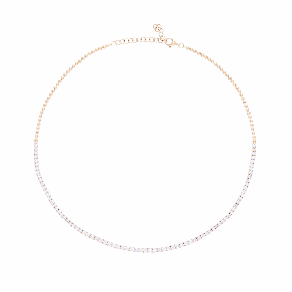 One of our favorite necklaces at LaNae - easy to wear casual, or for a big night out. This diamond choker with four carats of diamonds set into 14k yellow gold is a huge look. Wear up high and layer with other diamond station necklaces or wear on its own for the big look that it is. You'll love wearing this with a simple t-shirt and jeans. Comfortable to wear, stays in place and doesn't roll. <div>Diamond weight: 4.0ct</div> 1/2 Way Diamond Choker Necklace14k Gold with Diamonds
