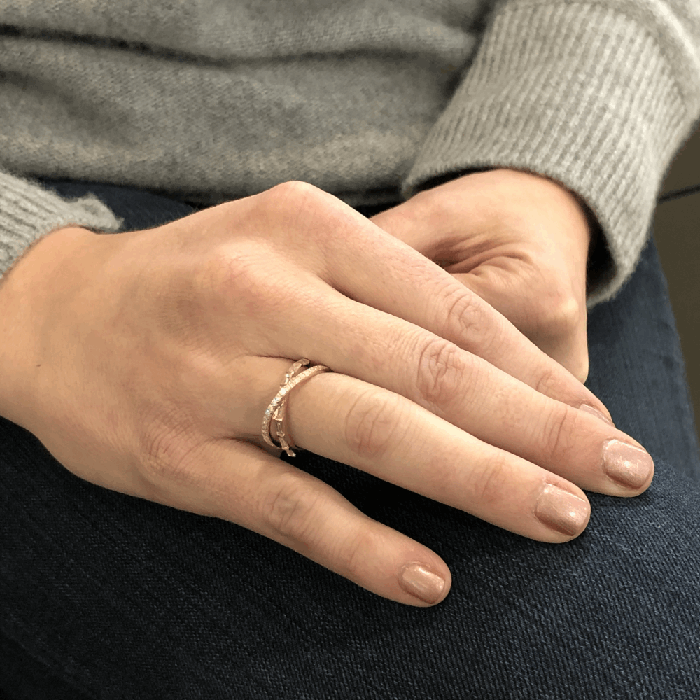 This 14k yellow gold step and brilliant cut diamond crossover ring is perfect to wear as an every day ring. Comfortable, doesn't snag, and has enough dimension with both types of diamond cuts to make this not a ring you see everywhere. Slimmer side profile as well so it isn't bothersome in width. You'll love putting this on every day, it's a pleasure to look at. It has 3.15 g of 14k gold and .6 carats of diamonds. Yellow Gold Step Cut Diamond Cross Over Ring