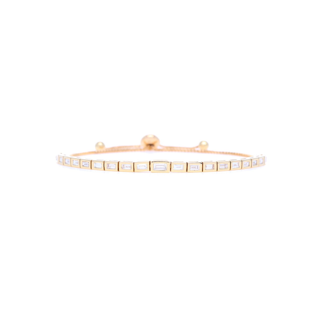This 14k yellow gold bolo bracelet contains .85 carats of baguette cut diamonds. This versatile and adjustable bracelet can be worn stacked or on its own depending on preference. 14k Yellow Gold Step Cut Diamond Bolo Bracelet