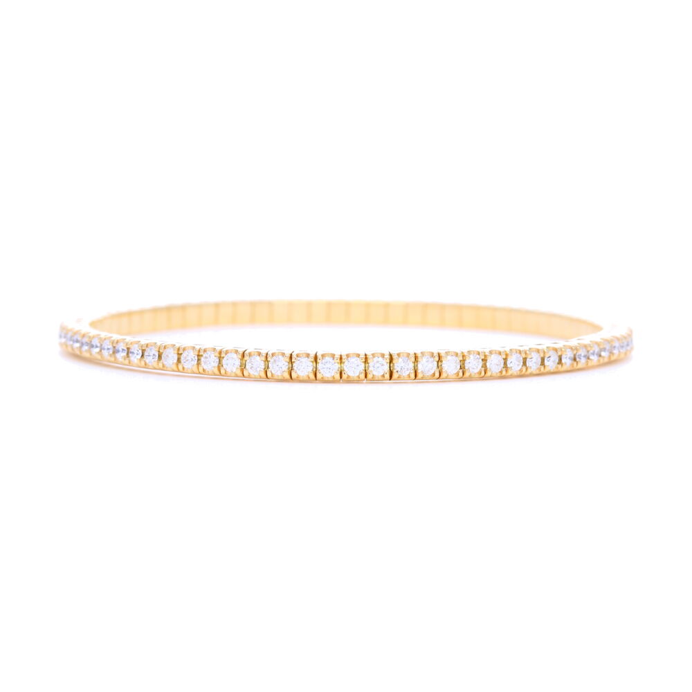 This is 18k gold flexible bracelet contains 2.35 carats of brilliant cut white diamonds. This bracelet fits up to a size 7 inch wrist comfortably. Whether wearing this bracelet casually or dressed up, this will soon become your favorite bracelet. This bracelet comes in a rose, yellow or white gold. Italian 18k Gold Flexible Prong Set Diamond Bracelet
