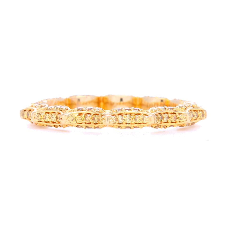 This uniquely designed "Taj" ring by Vivaan sets .75 carats of diamonds in an 18k yellow gold a swooping eternity ring pattern. One of the most unique eternity rings we carry, it adds stunning dimension to any stack ring set, yet is substantial enough to be worn alone.
"Taj" Yellow Diamond Stack ring In 18k Yellow Gold