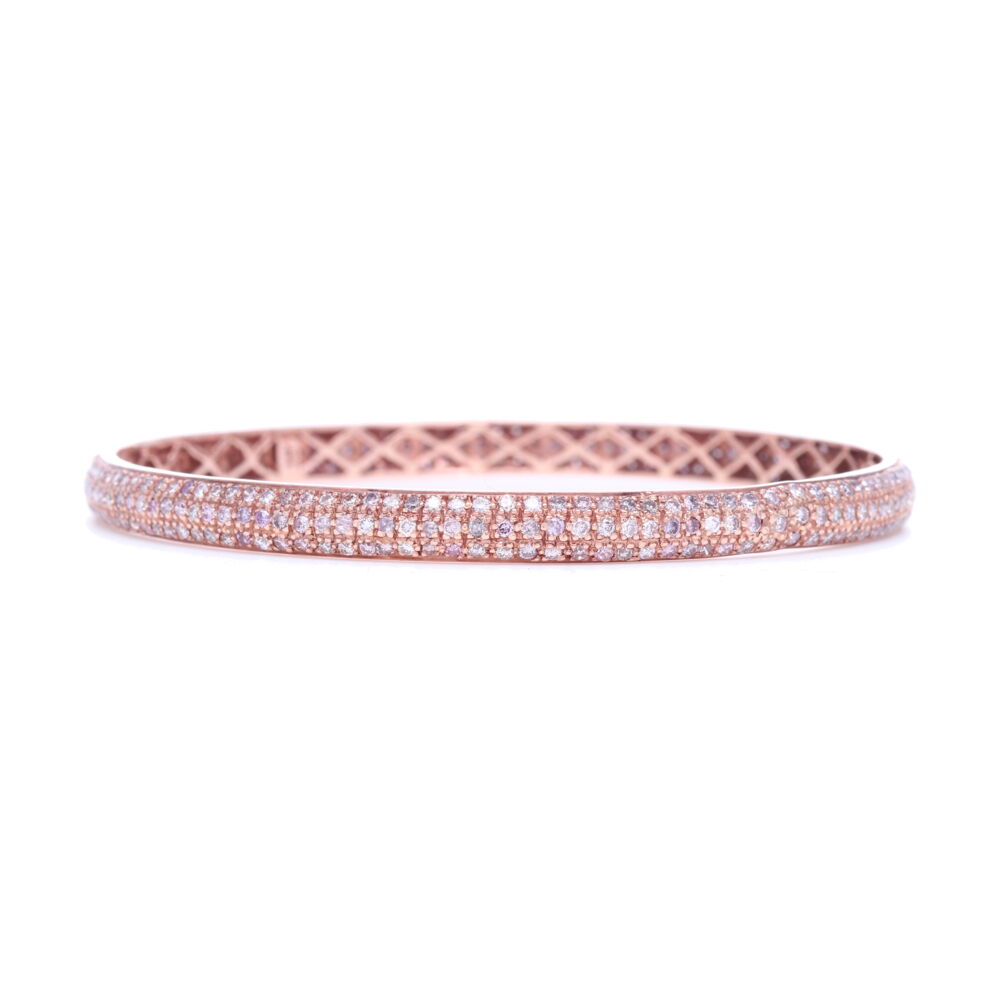 4.16 carats of pink diamonds set into 14.32 g of 18k rose gold would make anyone swoon for this arm candy. Everyone knows bracelets need friends, check out the other colors. Tyre Bangle Bracelet with Pink Diamonds Set in 18k Rose Gold