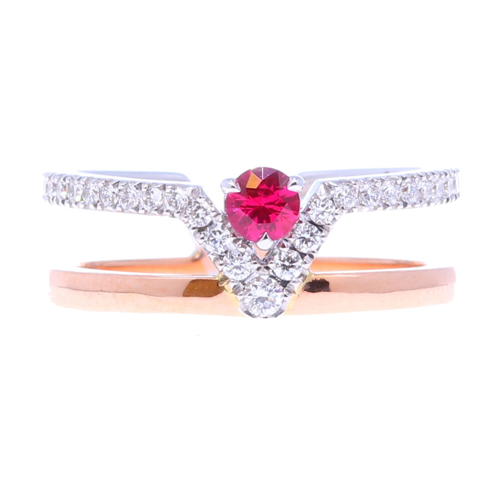 Double band. One 18k white gold band littered with sparkling diamonds: with a V shape on the top of the band that connects to an 18k rose gold band. In the middle of the V sits a magnificent ruby. Ruby V Double Band Ring