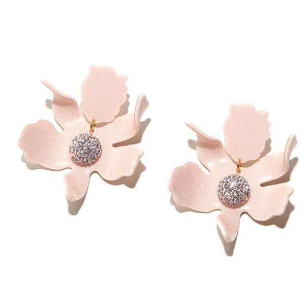These dusty pink earrings feature a large lily with a center of small crystals, guaranteed to shine. Dusty Pink Crystal Lily Earrings
