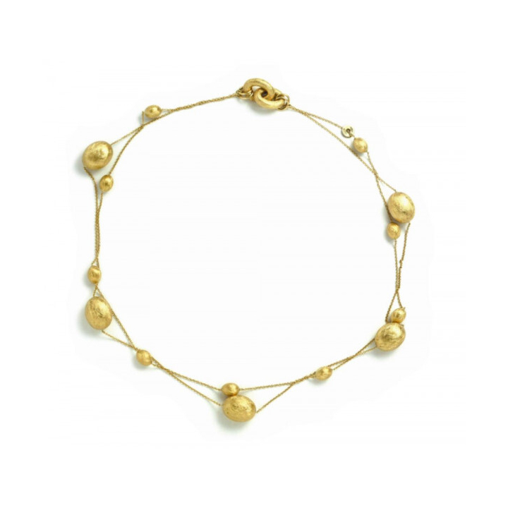 This gorgeously gold necklace features two thin chains, with one featuring small brushed beads: while the other features larger brushed gold beads. Both connect together at the clasp. Dancing In The Rain Multi Bead Necklace