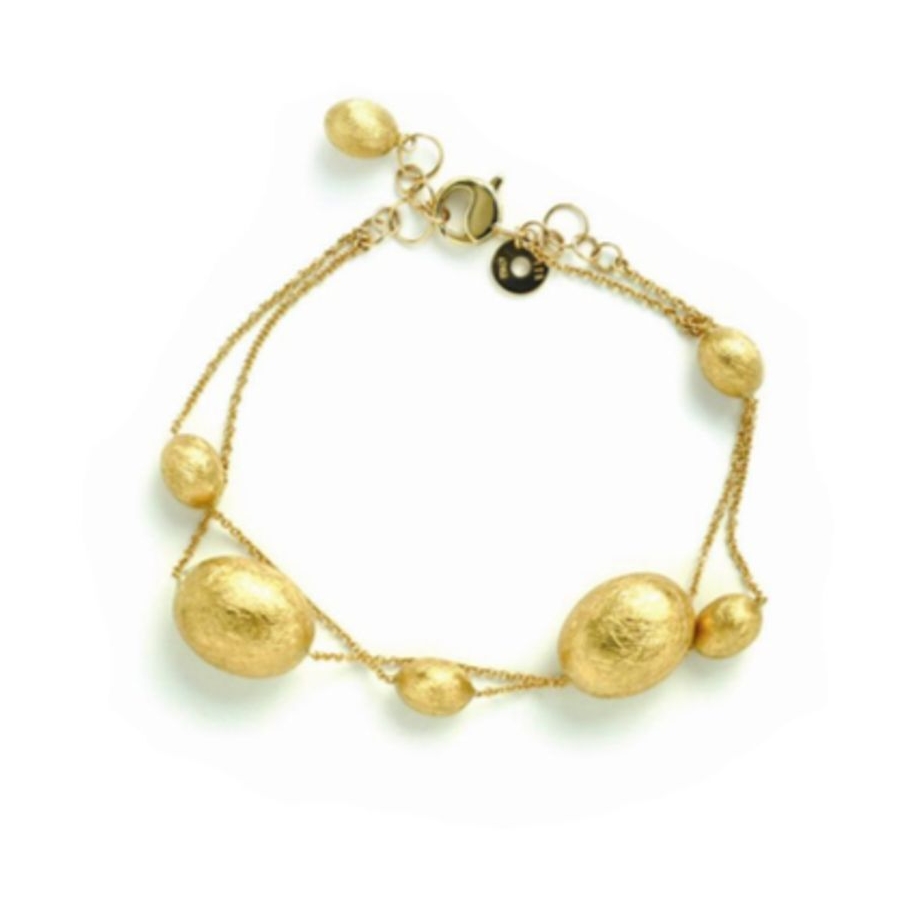 This beautifully brushed gold double linked bracelet features 18k yellow gold beads displayed on a thin chain. Dancing in the Rain Double Bracelet