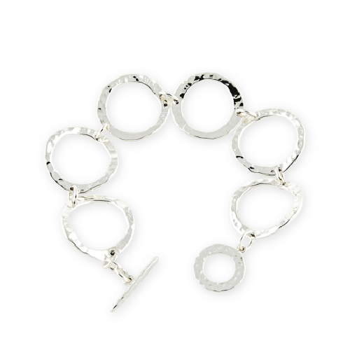 In 1989 Zina Sterling Silver moved into our Beverly Hills headquarters that accommodates our workshop as well as Zina 'The Store'. The store is a showcase for all that is 'today' in fine design in jewelry, gift ware, Judaica, frames and whatever Zina thinks is new and exciting that crosses her path. Zina is a destination for people seeking the finest in design . Zina is at the pulse of what is 'happening' Open Ripple Links Bracelet