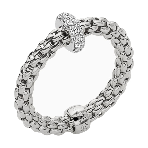 A thin, flexible Fope ring from the Prima collection that can stretch from a size 7-8 crafted in 18K gold. It features a rondel station at the center with .18tcw of diamonds. Flex-it Ring With Diamonds