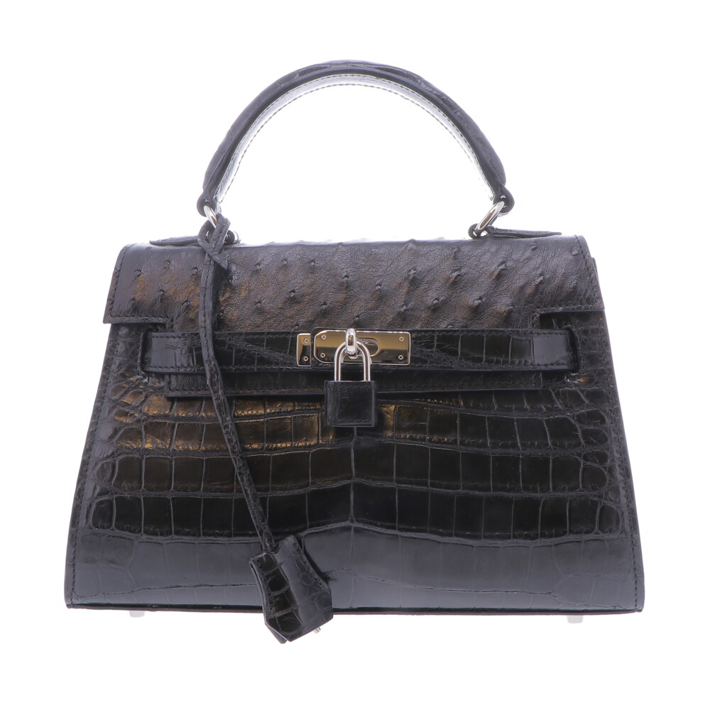 LaNae's Small Black Top Handle Classic Style handbag has been handcrafted using farmed Nile Crocodile with Ostrich, all of the hardware is Italian Palladium and the interior is lined with lightweight durable garment quality suede. Small Black Top Handle Handbag