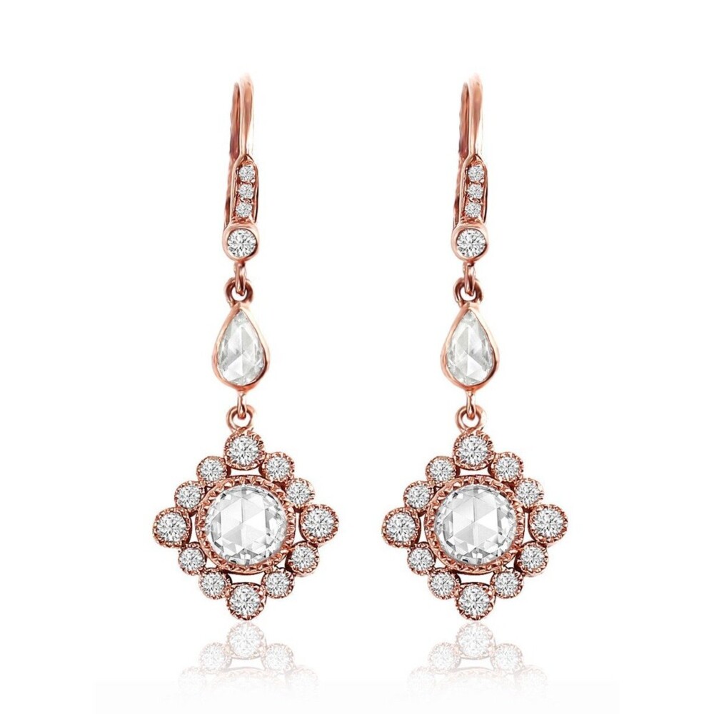 These earrings are dripping with diamonds! From the gorgeous center stone, to the halo surrounding it, the teardrop shaped diamonds, and the finely crafted closures.<div>Earrings contain 1.36tcw of brilliant cut white diamonds, all set in 18k Rose Gold.</div> Love Song Earrings 18k Gold with Diamonds