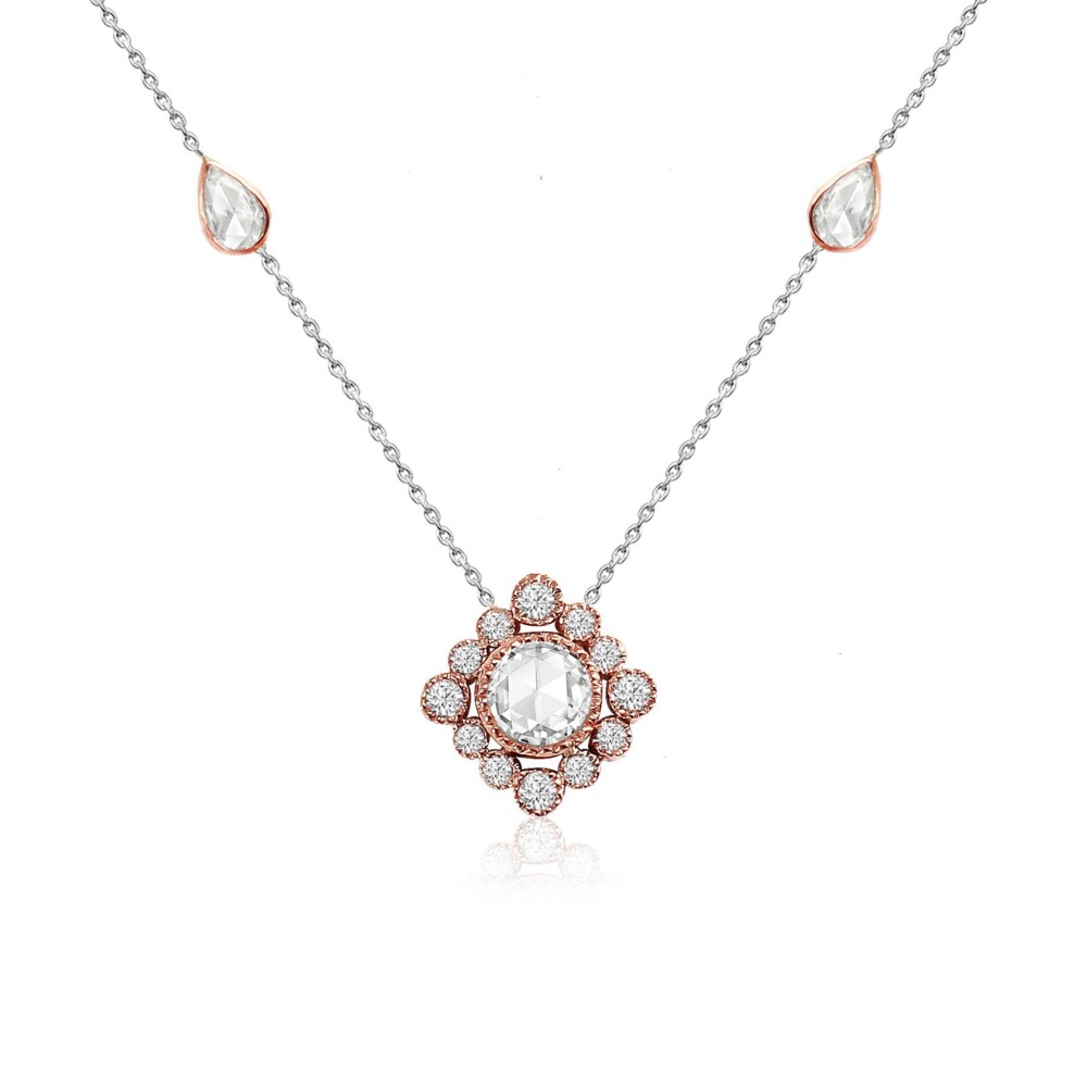 Made to complement its earrings counterpart, this necklace features a beautiful diamond center stone surrounded by a halo of diamonds, with teardrop shaped accent diamonds totaling 0.56cts. Collect the set, and make an even bigger splash at your next big event. Love Song Necklace 18k Gold with Diamonds