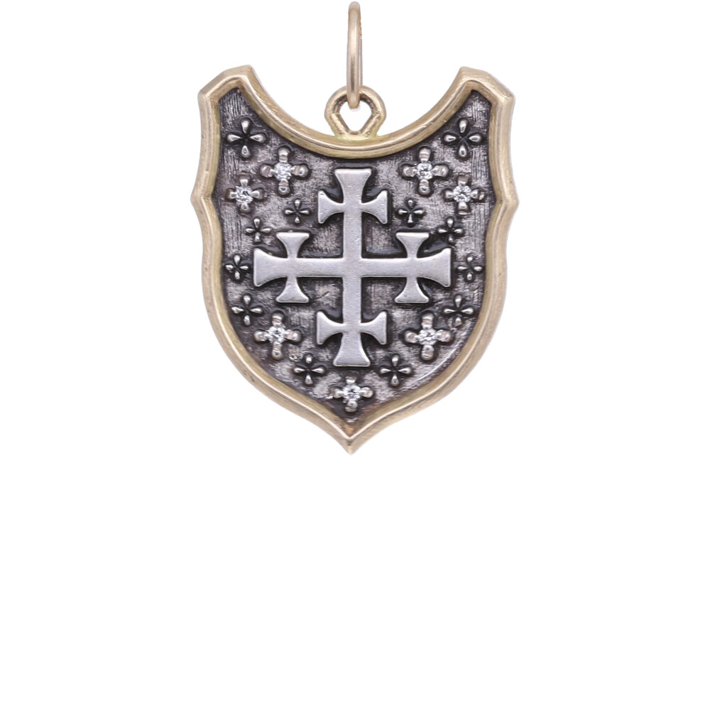 <div style="position: initial; margin: initial;">18k & Blackened Sterling Silver Large Funky Shield Pendant with Multiple Crosses, on the reverse reads in Italian "La bellezza motiva lanima ao agire" which translates too <span style="font-family: inherit; font-size: 1.2rem;">"Beauty awakens the soul to act" by Dante Algheri.</span></div> 18k Large Multi Cross Shield Pendant
