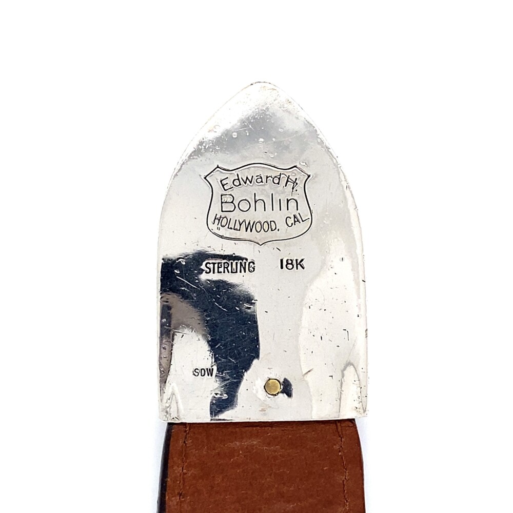 <div style="color: rgb(51, 51, 51); font-family: Platinum1911; font-size: 11.9px; position: initial; margin: initial;">Wow! A legit vintage Edward H. Bohlin Hollywood, CA original in 925 sterling and 18K yellow gold with 4.50tcw round brilliant diamonds and .70tcw rubies! Bohlin Company, since 1920, has offered made-to-order custom accessories, crafted from the highest-quality materials. They carry everything from rings and watches to belt buckles and money clips perfect for a custom design, just like this amazing find circa 1980. Inspired By Hollywood and the Old West Have you ever watched an old western and noticed the beautiful custom belt buckles. Well, there is a good chance those buckles were crafted by The Bohlin Company. The founder started his career making custom pieces for Hollywood, and even today is still inspired by those unique designs.</div><ul style="padding: 10px 20px 10px 30px; margin-block: 0px; float: left; width: 550px; color: rgb(51, 51, 51); font-family: Platinum1911; font-size: 11.9px; position: initial; margin: initial;"></ul> Bohlin Custom Belt Buckle 925 & 18k 4.50tcw Diamonds & Rubies on Alligator Strap