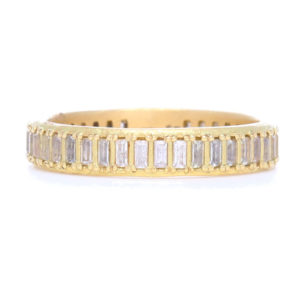 This 18k yellow gold band ring displays wide channel-set white sapphire baguettes going entirely around the band. This ring is perfect to stack with others, or has enough personality to wear alone. Sueno 18k Yellow Gold Ring With Diamonds