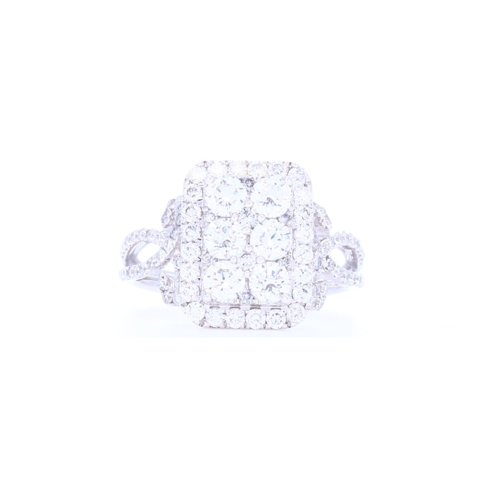This rectangle shaped cluster ring has 1.81 carats of brilliant cut diamonds, set in 4.21 grams of 18k white gold, arranged close together to appear as one large stone. Prong set diamonds down the shank add a beautiful feminine touch to this ring.<div>Diamond weight: 1.81ct</div> 18k White Gold Rectangle Shape Cluster Diamond Statement Ring