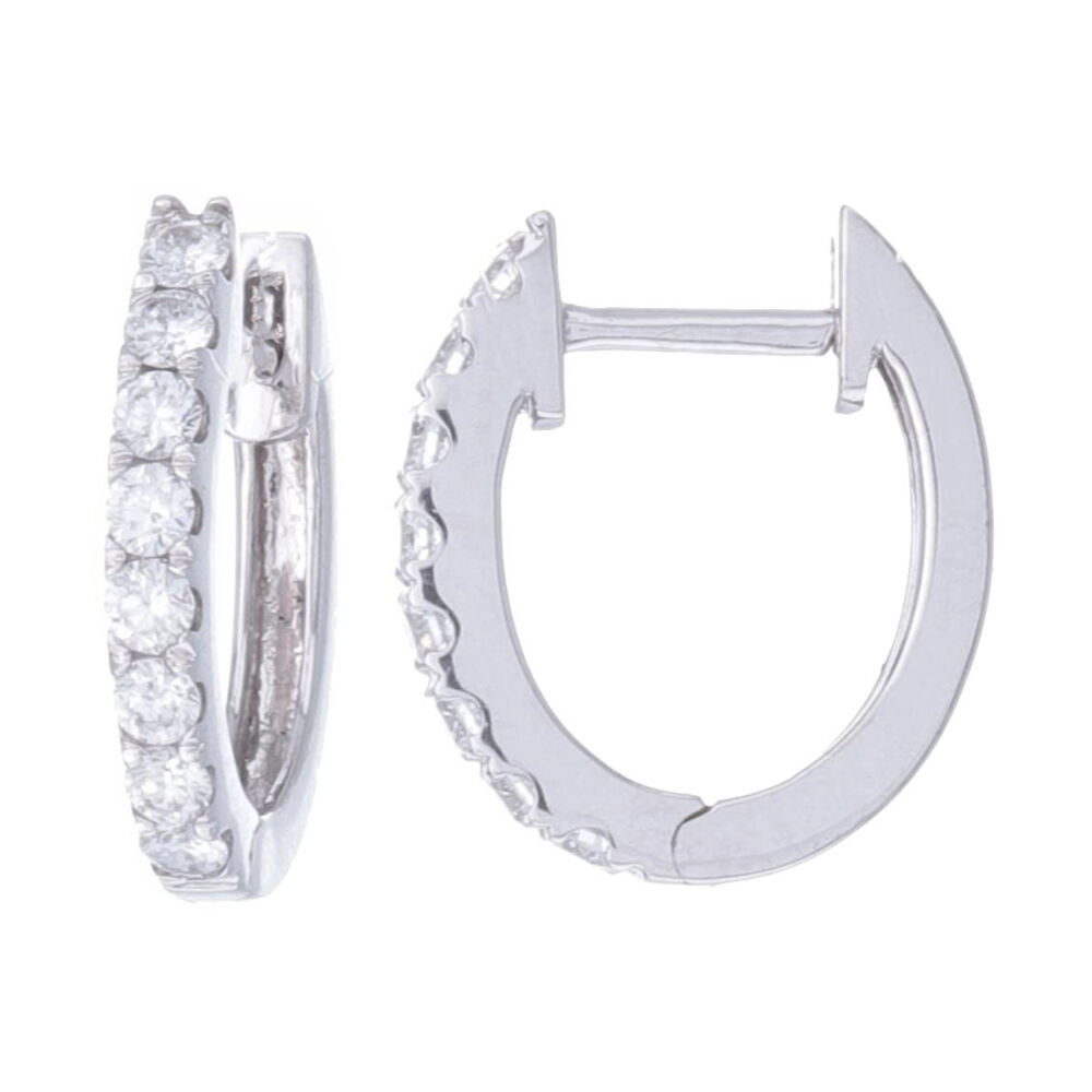 Perfect every day huggie hoop made form 18k white gold and .4 carats of diamonds. Plenty of earring charms from popular designers also fit on these hoops if you like to wear them with charms. 18k White Gold Oval Shaped Prong Set Brilliant Cut Diamond Huggie Hoop Earrings