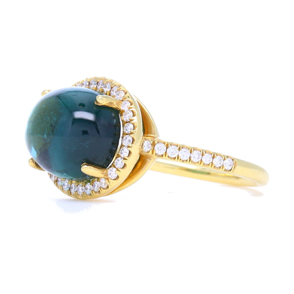 Every piece of the Lauren K Collection is proudly crafted in New York City. The Lauren K Collection is comprised entirely of handpicked gemstones, crafted in 18 karat gold, and finished with delicate micro pave. Each stone is carefully selected for a variety of reasons. In fact, very few are ever chosen for their unspoiled beauty. Instead, most stand out for their characters and flaws which give the finished piece its own distinctive personality and unique look. Our gemstones are always the “star of the show”. Nothing in the collection is mass produced, creating pieces that speak to each individual buyer. Each stone is one of a kind, the finished product may vary to the stock photo as shown.
18k Yellow Gold, Tourmaline, Diamonds 0.31 TCW Tourmaline Cabochon Ring with Diamond Halo