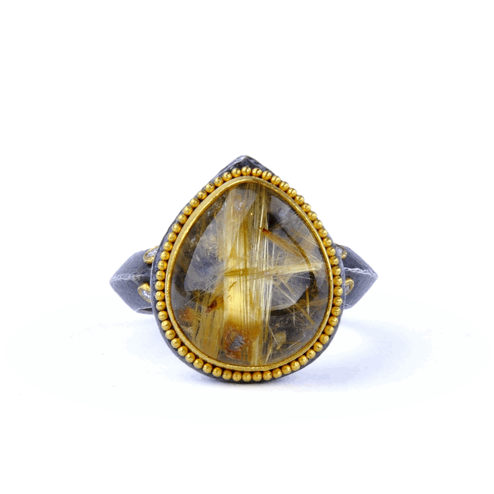 Pear shaped cabochon rutilated quartz ring set in 24k gold and oxidized sterling silver. Made by Kurtulan out of turkey. This ring is easy to wear casually or everyday. Kurtulan Rutilated Quartz Ring