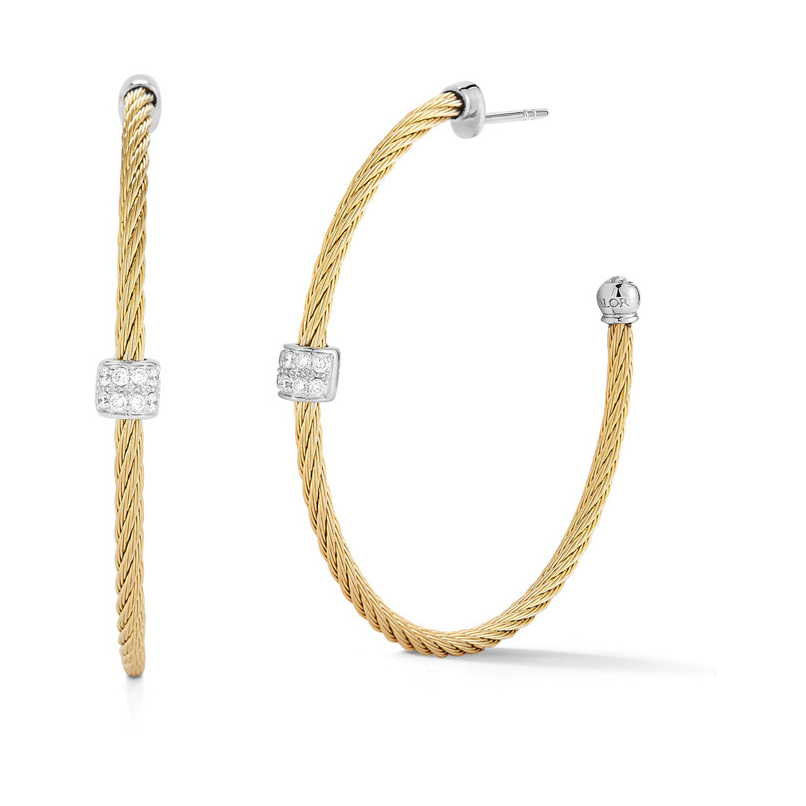 Perfectly lightweight, these hoops will be you next everyday favorite. Made from Alor's patented heat treated stainless steel cable with diamond set in 18k white gold. <div><br></div><div><ul><li>Available in Grey, Black, and Yellow</li><li>18k Post and Settings</li><li>0.13tcw of Diamond</li><li>Lightweight</li></ul></div> Single Diamond Station Hoop Cable Earrings