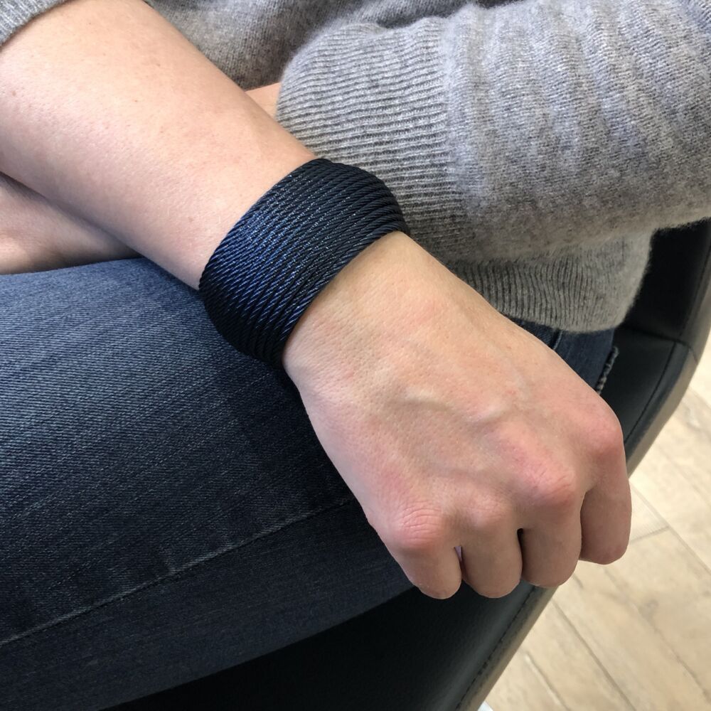 This 14 strand heat treated blueberry colored steel cable features an ovaled dome design. Very exquisitely simple, this cuff bracelet features an open end, perfect for any size wrist! Blueberry Large Stacked Cuff