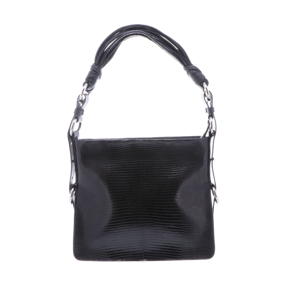 RICH IN STYLE. Indulge in a Luxurious Genuine Lizard and Ostrich trimmed Skin Handbag. LaNae's handbags are one of a kind, and made in the United States. All the edges are hand painted and trimmed in Italian Palladium hardware. Adjustable shoulder strap adjusts to approximately 9 in from the top of the strap to the top of the handbag (the shortest length). The longest length
measures 11 1/2 inches long. Each handbag is fully lined with the softest and finest quality garment suede.This lovely handbag is truly functional for day and or evening. It features a large main compartment that zip closes, and a separate large zippered compartment. 11" W x 4" D x 9 1/2" H Black Lizard Shoulder Bag with Black Ostrich Trim