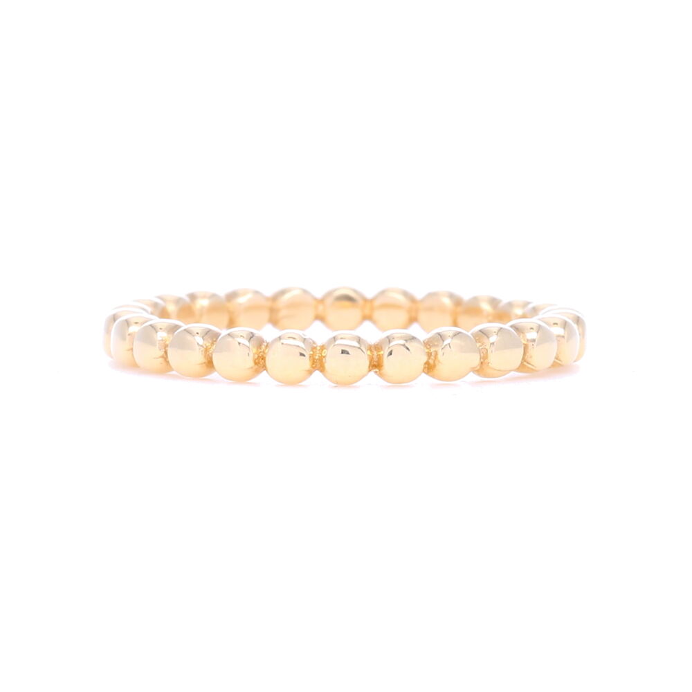 This dot ball eternity stack ring is typically seen as a way to "cage in" a vine ring or some other ring with negative space to create a framed in look. This is hands down one of our best sellers because it adds just enough dimension without being too thick. Variety is key with stack rings and this one is a way to bluff a stack quickly without being all diamonds all the time. 14k Gold Dot Ball Eternity Stack Ring