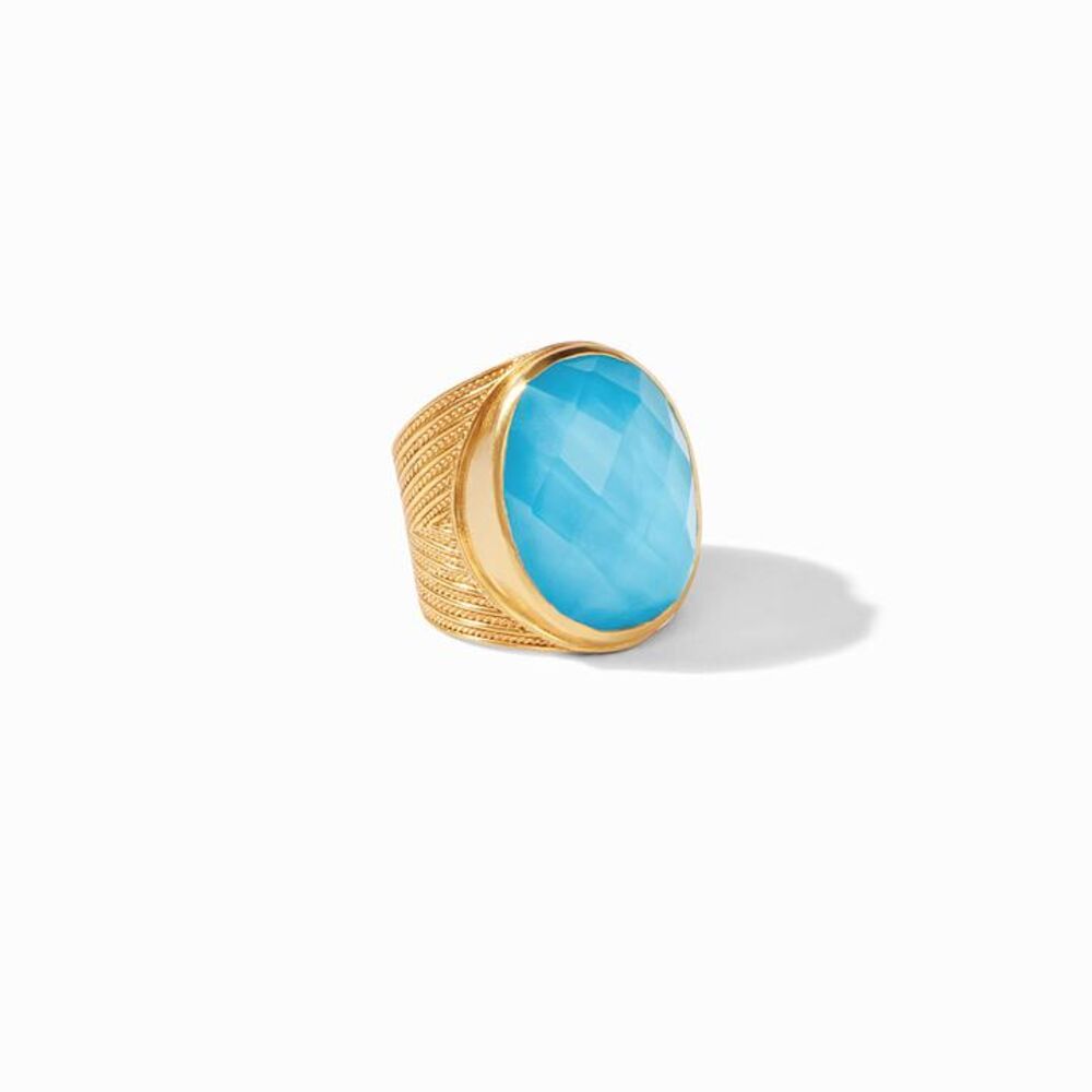 Radiant gemstone of richly hued rose-cut glass and mother of pearl, decorated with rows of elegant chevron detail on the tapered shank.
Open shank design
24K gold plate
Julie Vos hallmark Verona Statement Ring