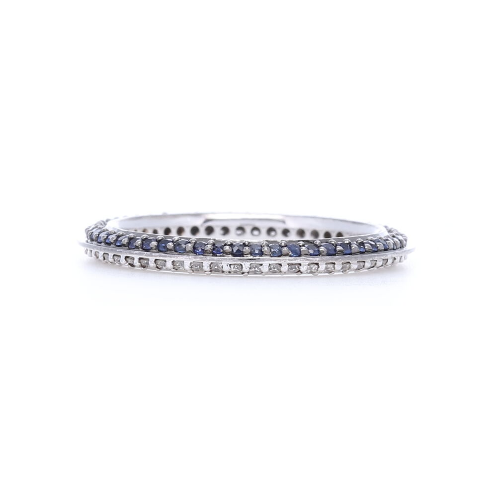 This 18k white gold knife edge stack ring adds color by making one side blue sapphires and the other side diamonds. Adds unique dimension to any stack ring set. 18k White Gold Blue Sapphire and White Diamond Knife Edge Stack Ring