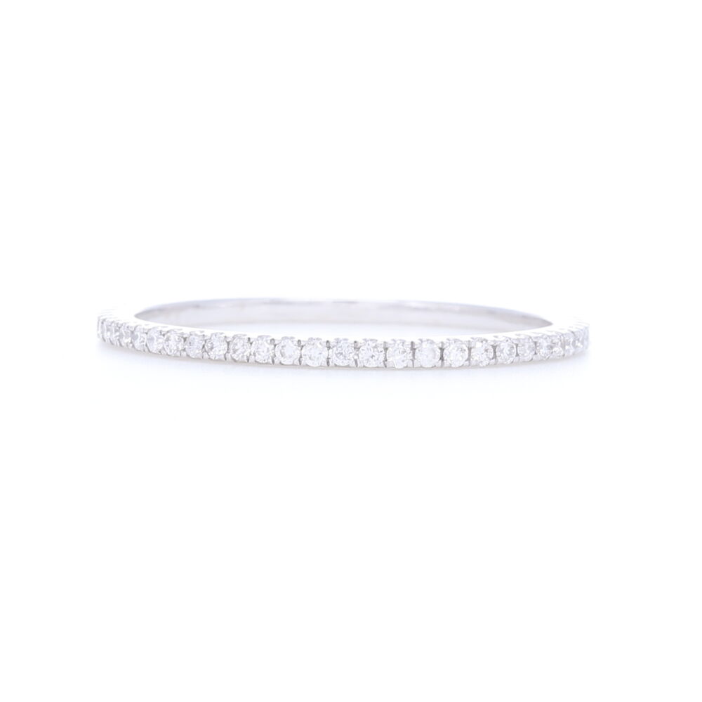 This classic 18k white gold diamond ring is an essential to every jewelry lovers collection. This versatile ring can be worn alone or stacked , and can also we worn for any occasion. 18k White Gold White Diamond Ring