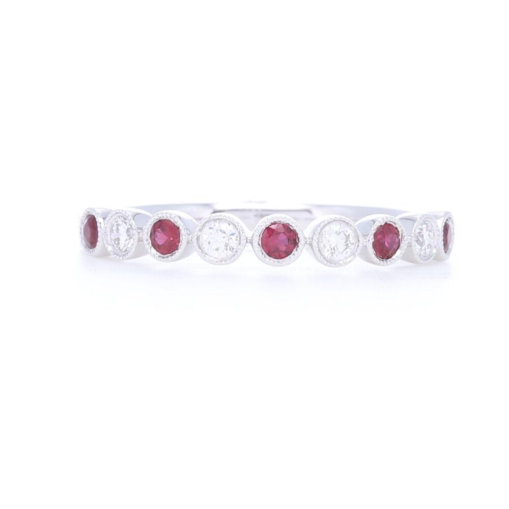 A Milgrain bezel set round diamond and ruby ring. This is a classic staple for any jewelry box! Milgrain Bezel Set Round Diamond and Sapphire Ring