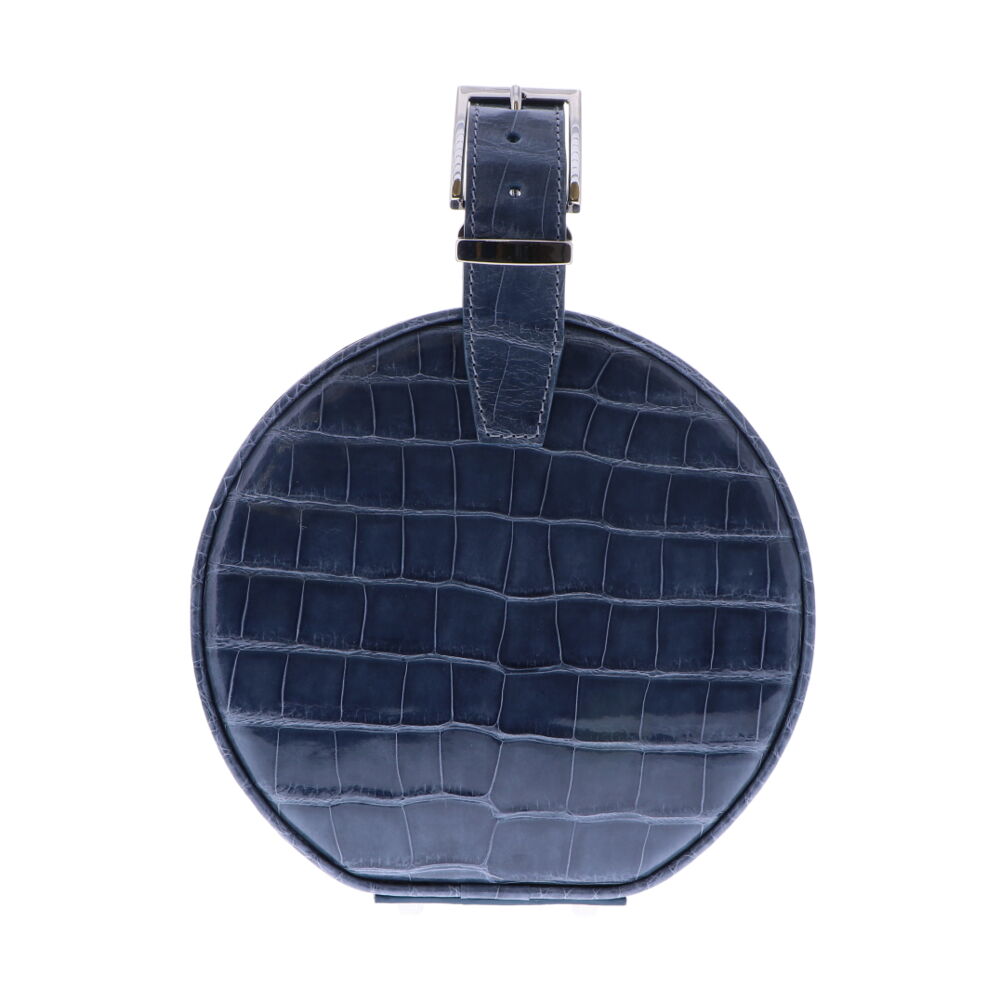 LaNae's Hat Box Chain Bag has been crafted out of genuine American Alligator with a premium High Gloss Steel Blue finish. Due to the premium quality of each high gloss skin our 3rd generation artisans are required to hand stitch each bag. As always our hardware is the finest Italian Palladium and each interior has been lined with a Garment Quality Suede which keeps each bag light yet durable. Proudly crafted in the United States. Slate Blue Alligator Hat Box Chain Bag