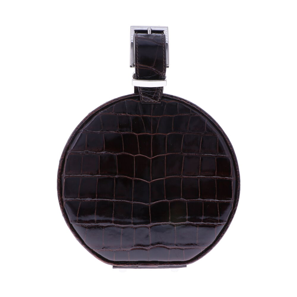 LaNae's Hat Box Chain Bag has been crafted out of genuine American Alligator with a premium High Gloss Chocolate finish. Due to the premium quality of each high gloss skin our 3rd generation artisans are required to hand stitch each bag. As always our hardware is the finest Italian Palladium and each interior has been lined with a Garment Quality Suede which keeps each bag light yet durable. Proudly crafted in the United States. Chocolate Brown Alligator Hat Box Chain Bag