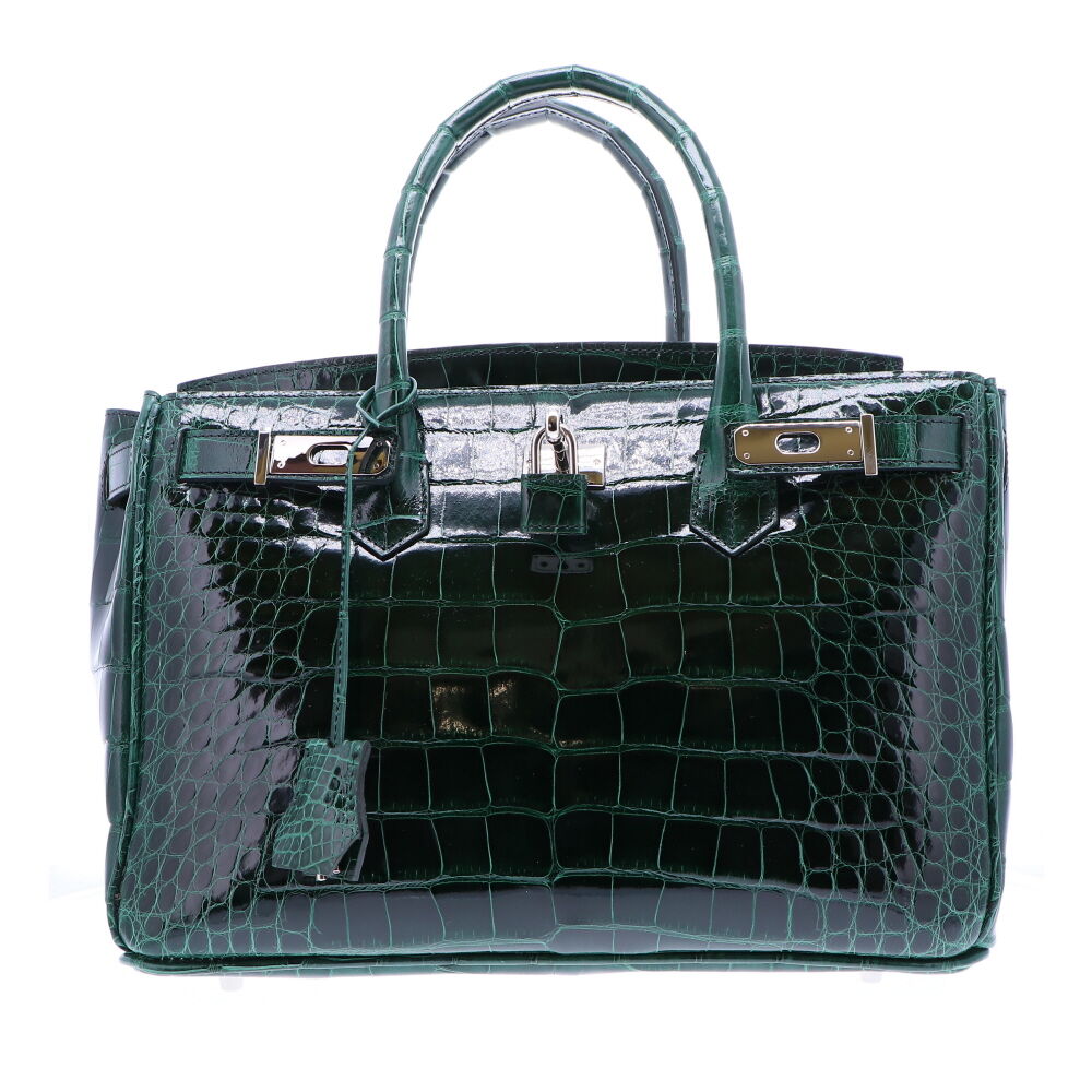 Genuine American Alligator Leather Satchel with a premium high gloss Emerald finish. The interior of the bag is finished with a light cream garment quality suede, and a large zipper compartment. This keeps the satchel light and durable. Gold plated Italian palladium hardware. Four silver color handbag feet. Classic 30 Forest Green Alligator Handbag